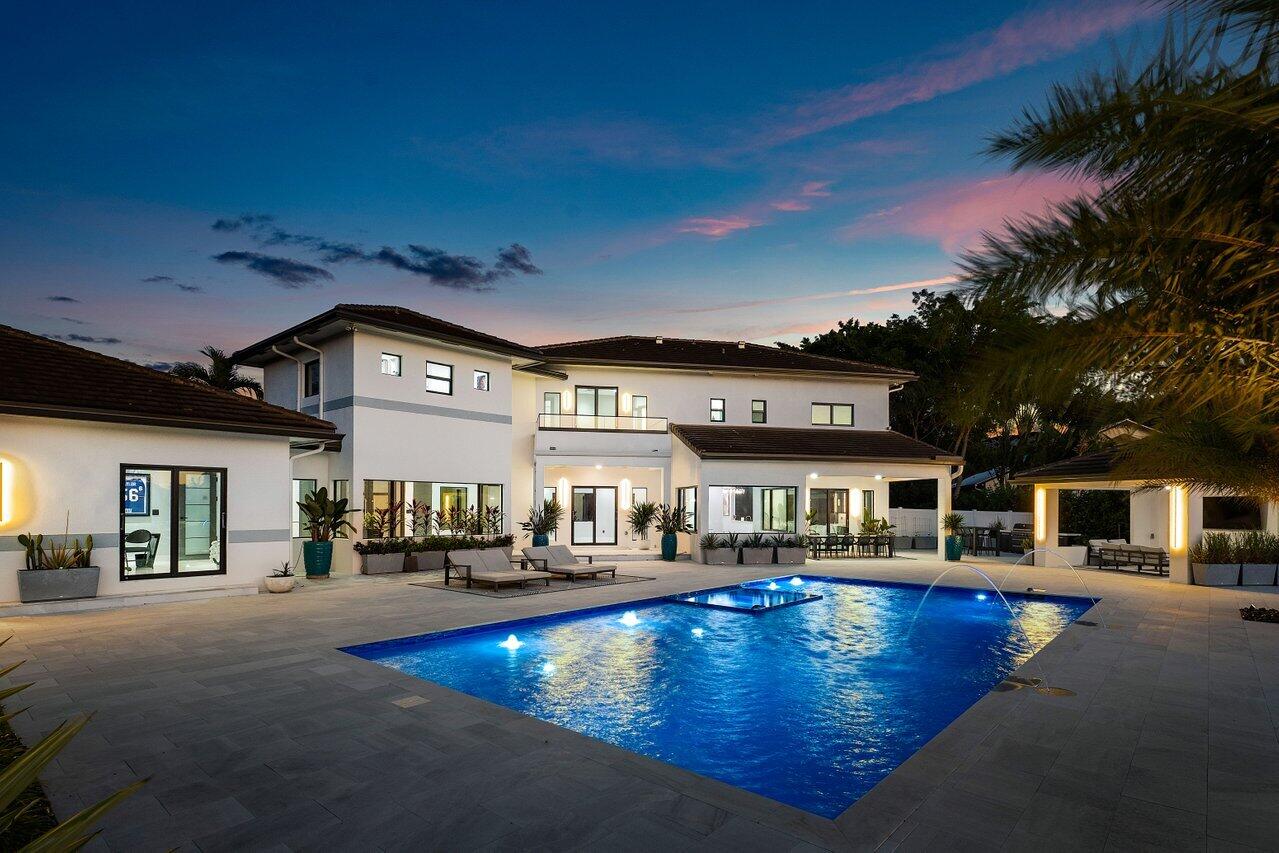 8387 Sawpine Road Delray Beach, FL 33446 - Photo 51 of 57 a view of a building with swimming pool