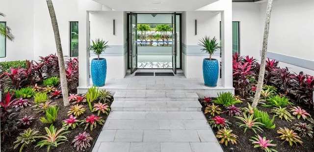 a view of living room with furniture and a large window