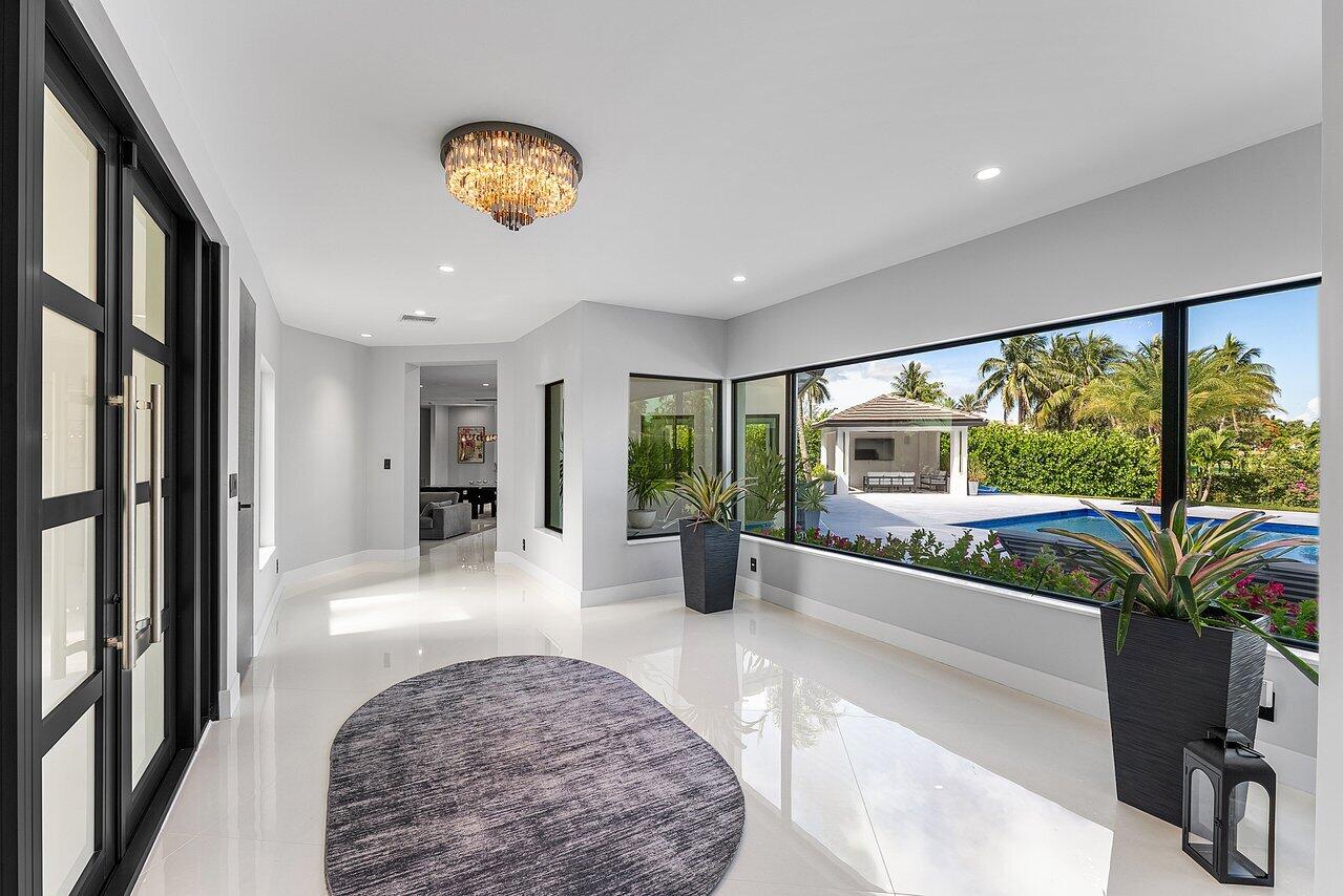 8387 Sawpine Road Delray Beach, FL 33446 - Photo 9 of 57 a view of living room with furniture and a large window