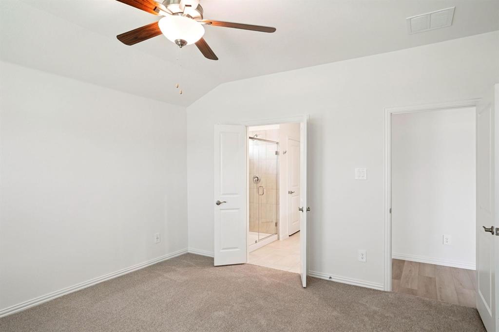 827 Sunflower Road Lavon, TX 75166 - Photo 17 of 23 an empty room with closet and a chandelier fan