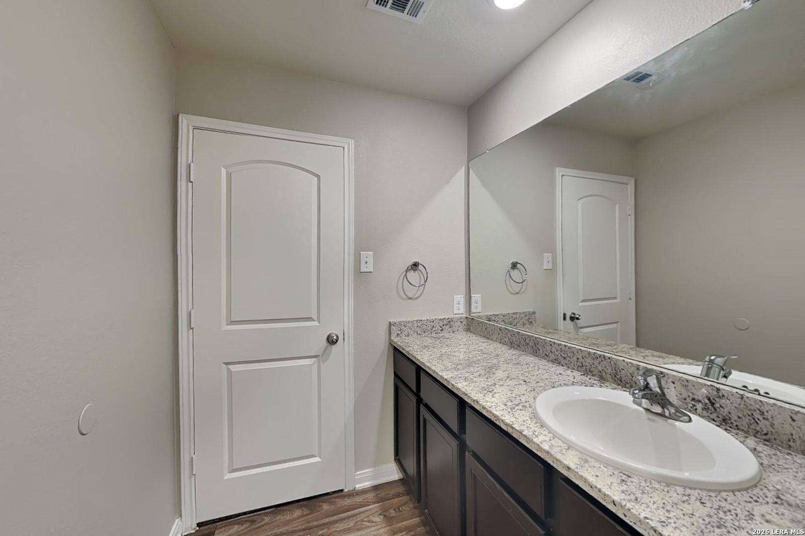 3022 Citron Garden Converse, TX 78109 - Photo 15 of 21 a bathroom with a granite countertop sink and a mirror