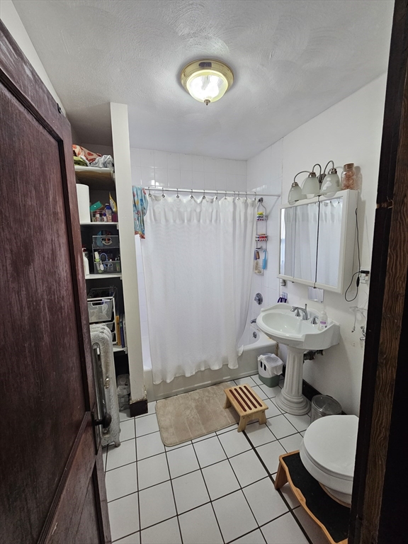 13 Roberts Road Cambridge, MA 02138 - Photo 13 of 23 a bathroom with a sink toilet and shower