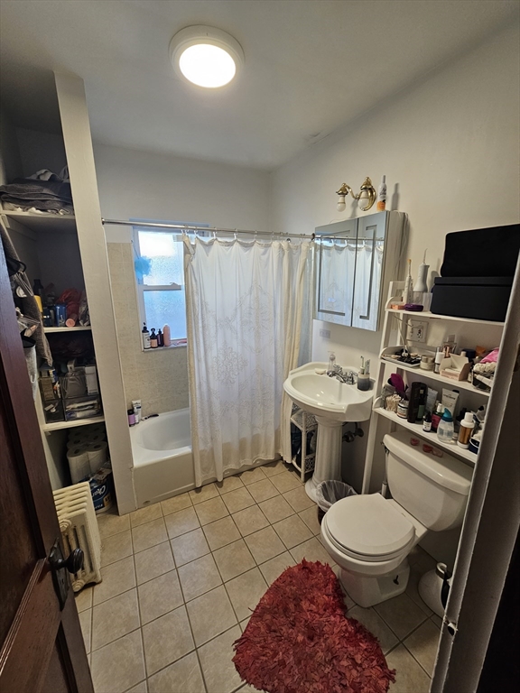 13 Roberts Road Cambridge, MA 02138 - Photo 19 of 23 a bathroom with a toilet a sink and a shower