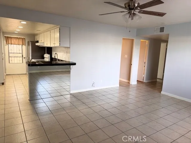 a view of a kitchen with a sink and a stove top oven