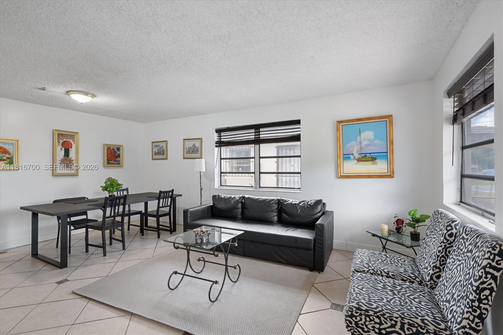 5726 Southwest 20th Street Miami, FL 33155 - Photo 13 of 27 a living room with furniture a rug and a window