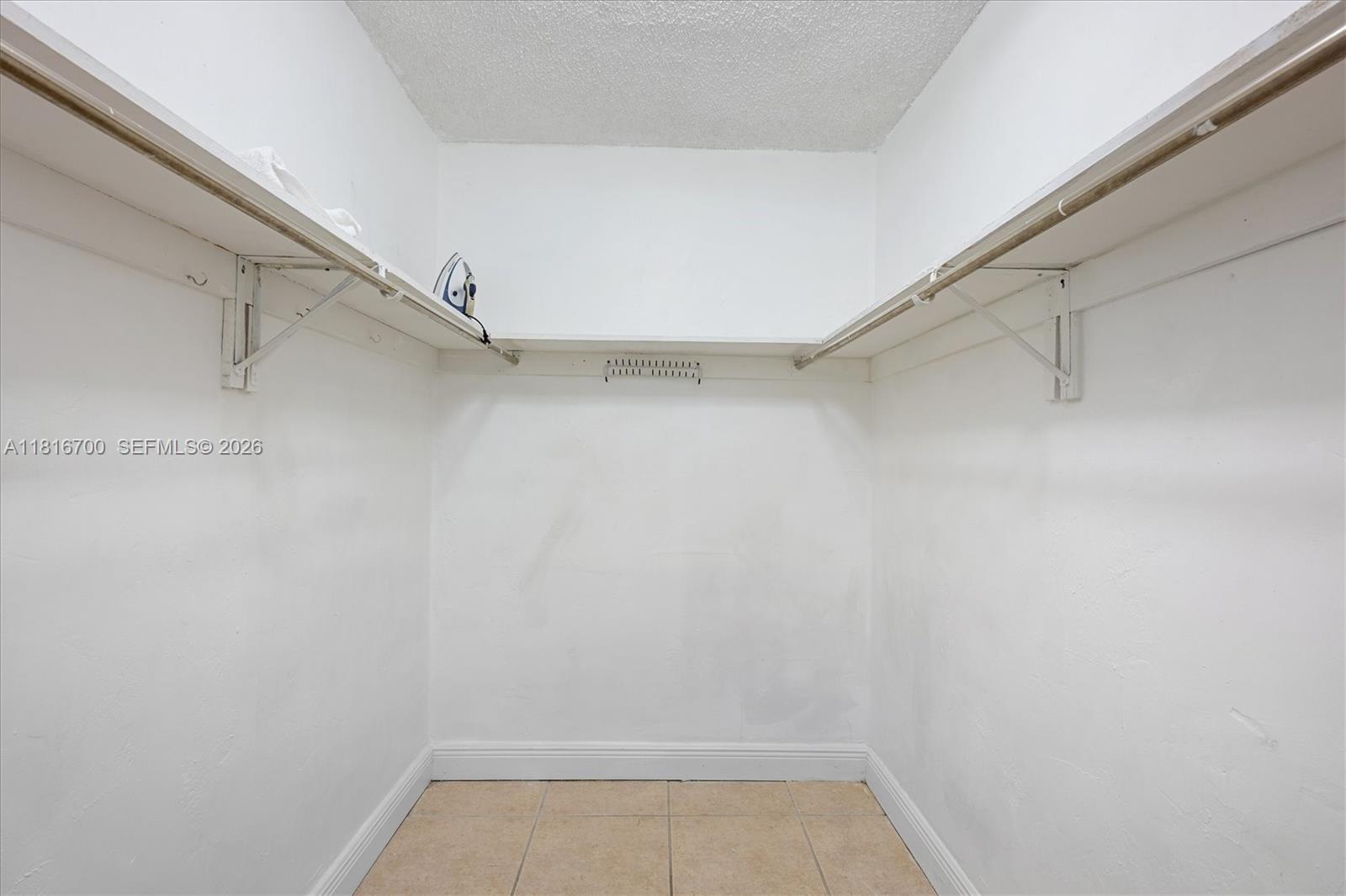 5726 Southwest 20th Street Miami, FL 33155 - Photo 17 of 27 a view of a room with racks on the wall
