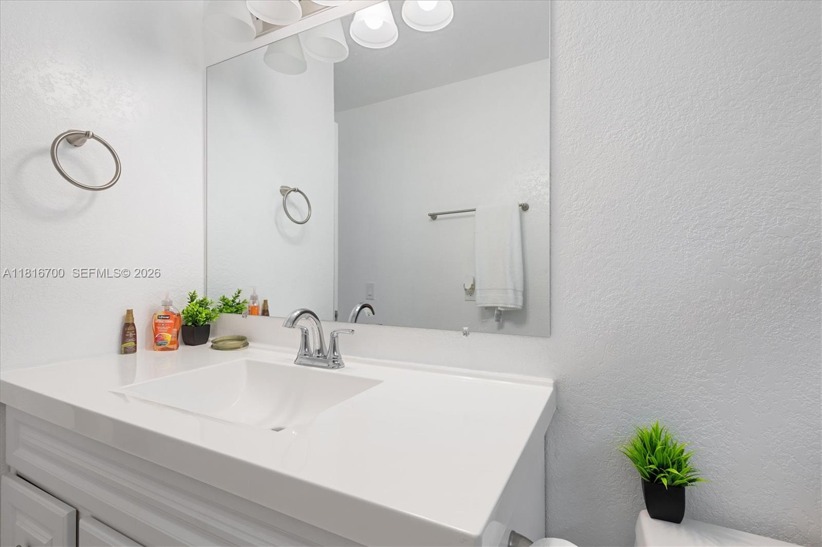 5726 Southwest 20th Street Miami, FL 33155 - Photo 20 of 27 a bathroom with a sink and a mirror