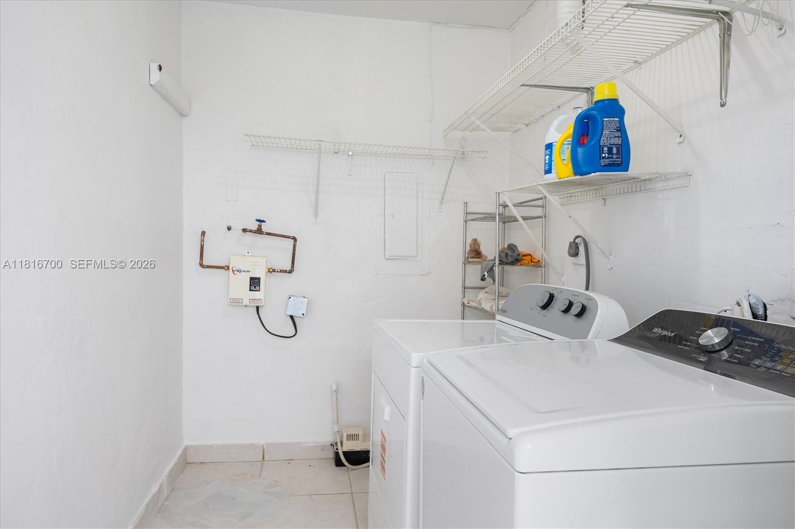5726 Southwest 20th Street Miami, FL 33155 - Photo 22 of 27 a room with a refrigerator and washer