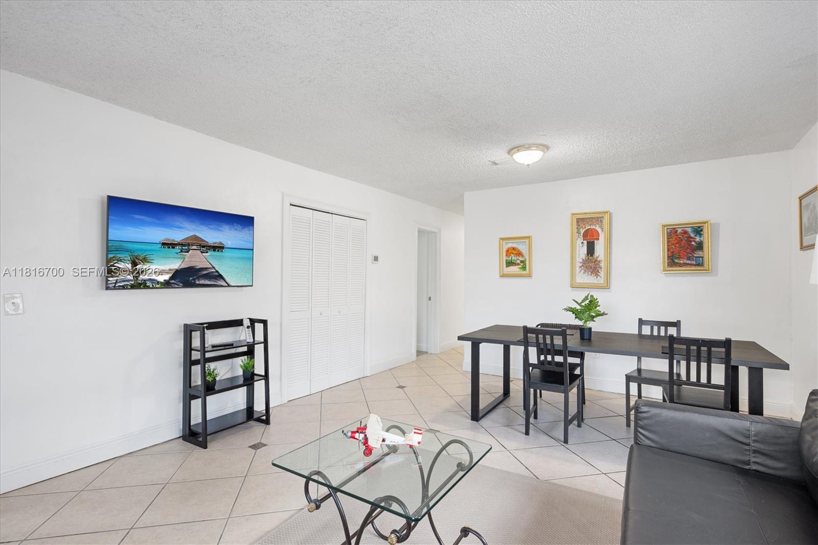 5726 Southwest 20th Street Miami, FL 33155 - Photo 10 of 27 a view of a livingroom with furniture and dining room