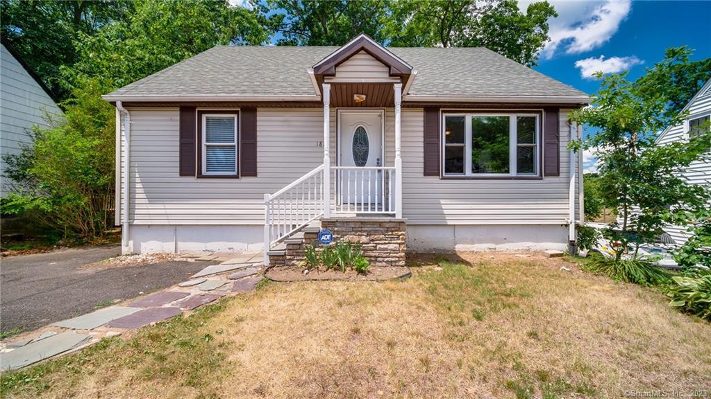 1825 Chopsey Hill Road Bridgeport, CT 06606 - Photo 1 of 1 a front view of a house with a yard