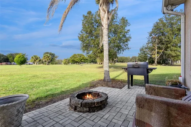 a front view of a house with garden and patio