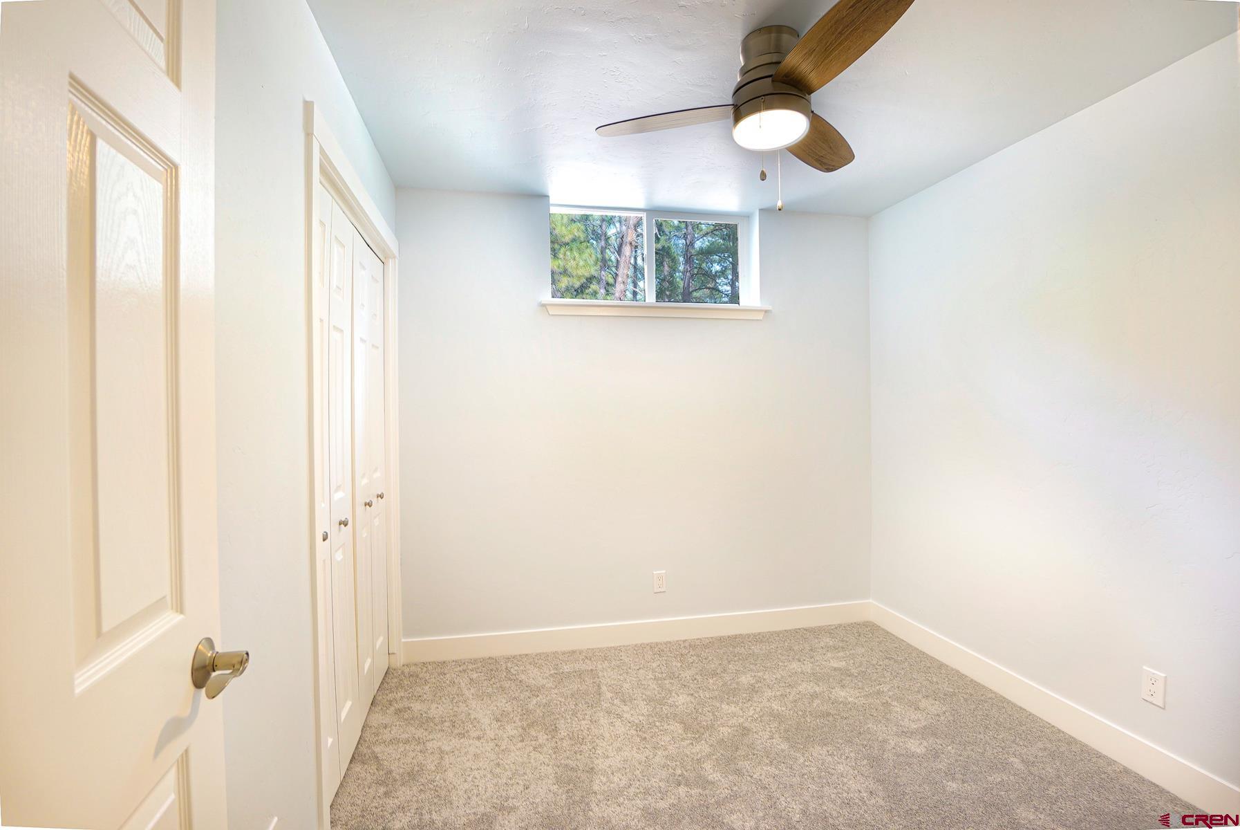 120 Sortais Road Durango, CO 81301 - Photo 17 of 21 an empty room with windows and closet