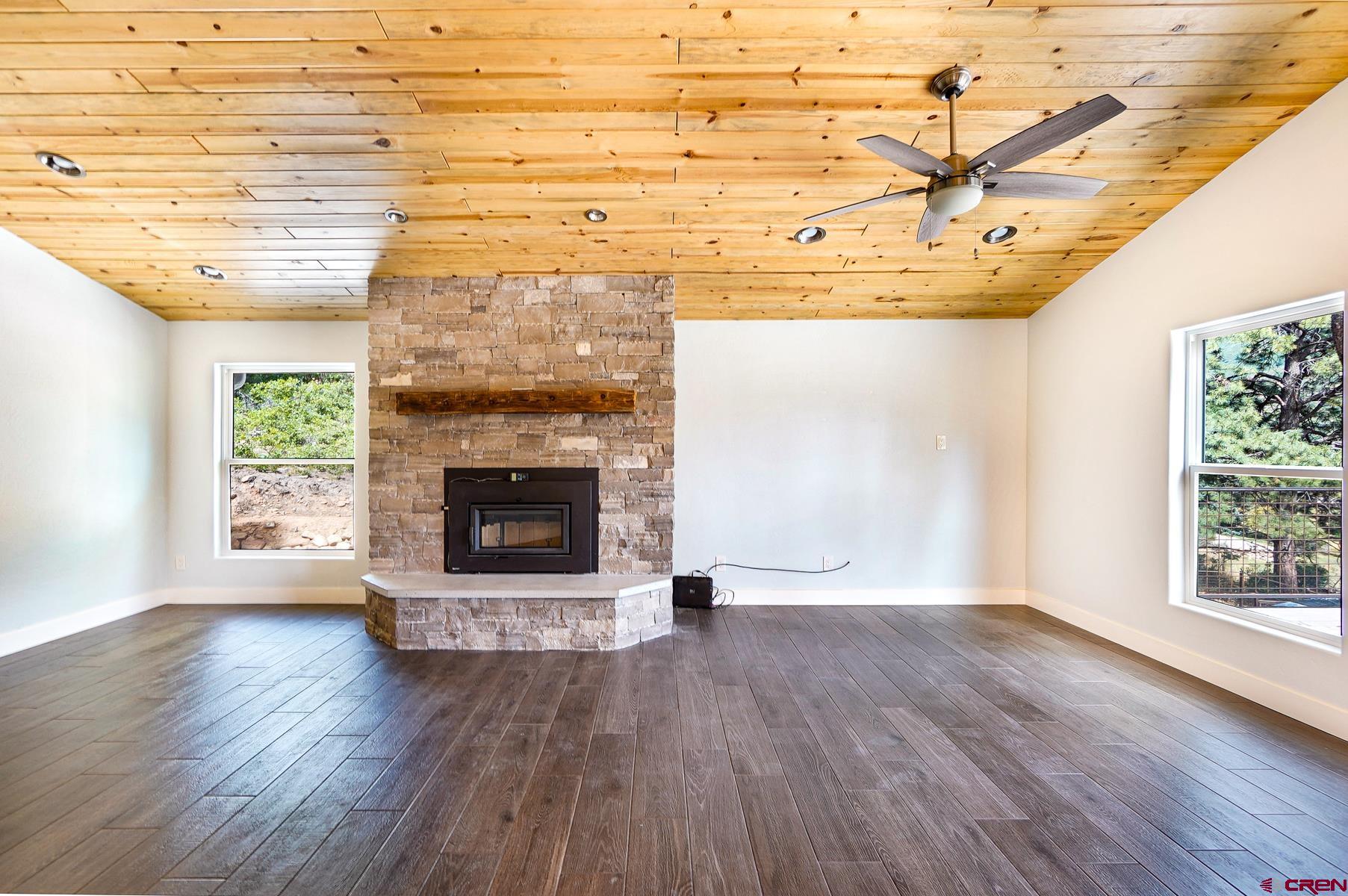 120 Sortais Road Durango, CO 81301 - Photo 4 of 21 a view of an empty room with wooden floor and a window