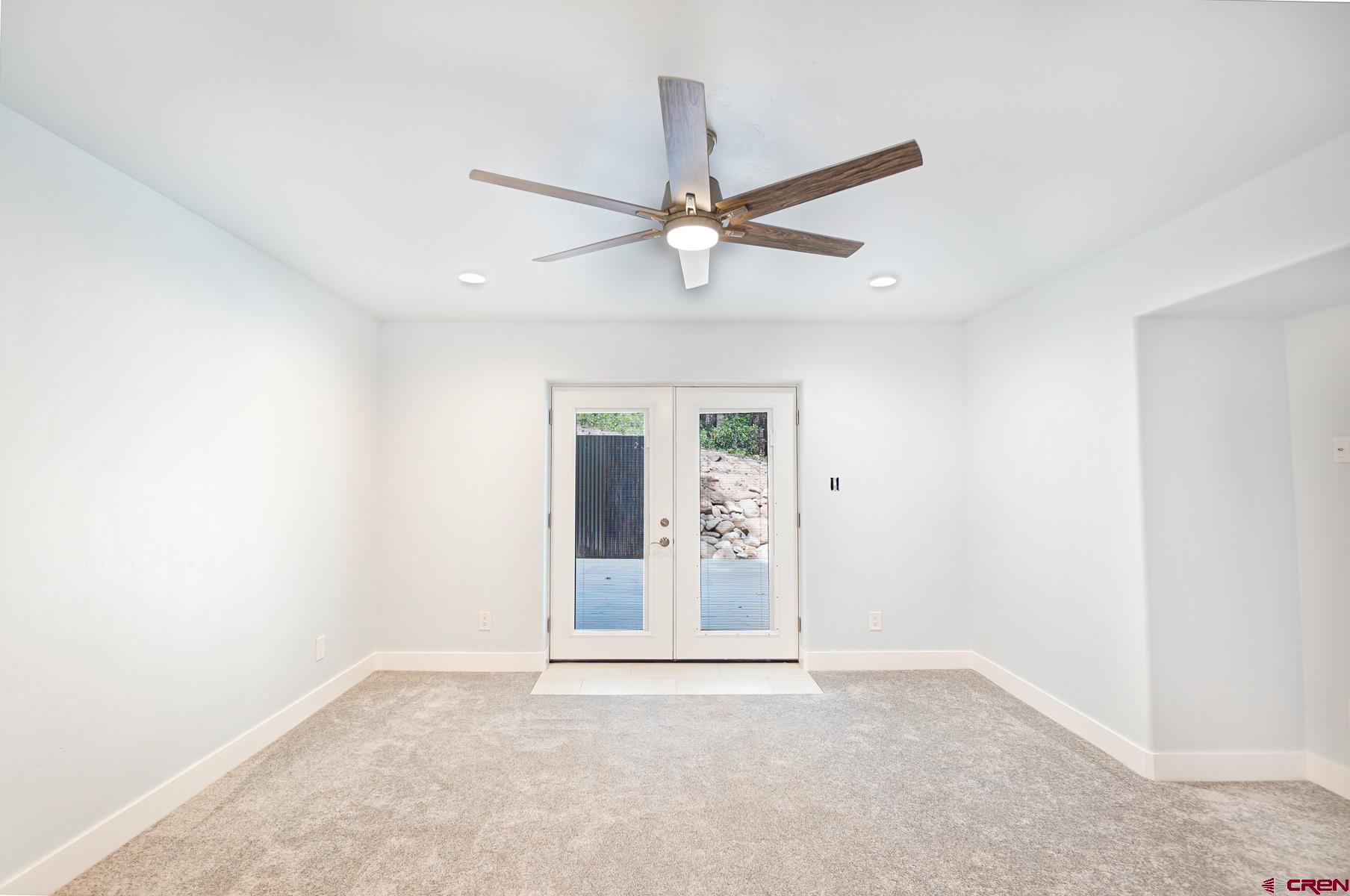120 Sortais Road Durango, CO 81301 - Photo 6 of 21 an empty room with windows and fan
