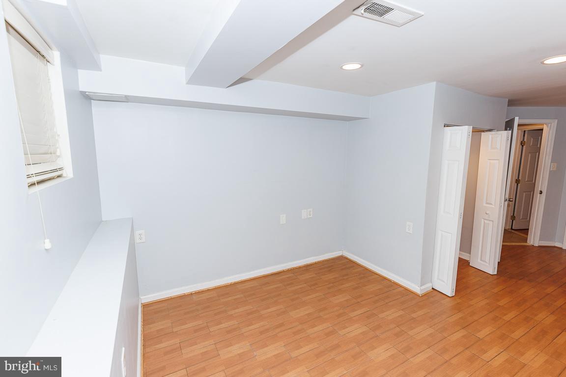 1437 East Capitol Street Southeast, Unit B Washington, DC 20003 - Photo 12 of 20 a view of empty room with wooden floor
