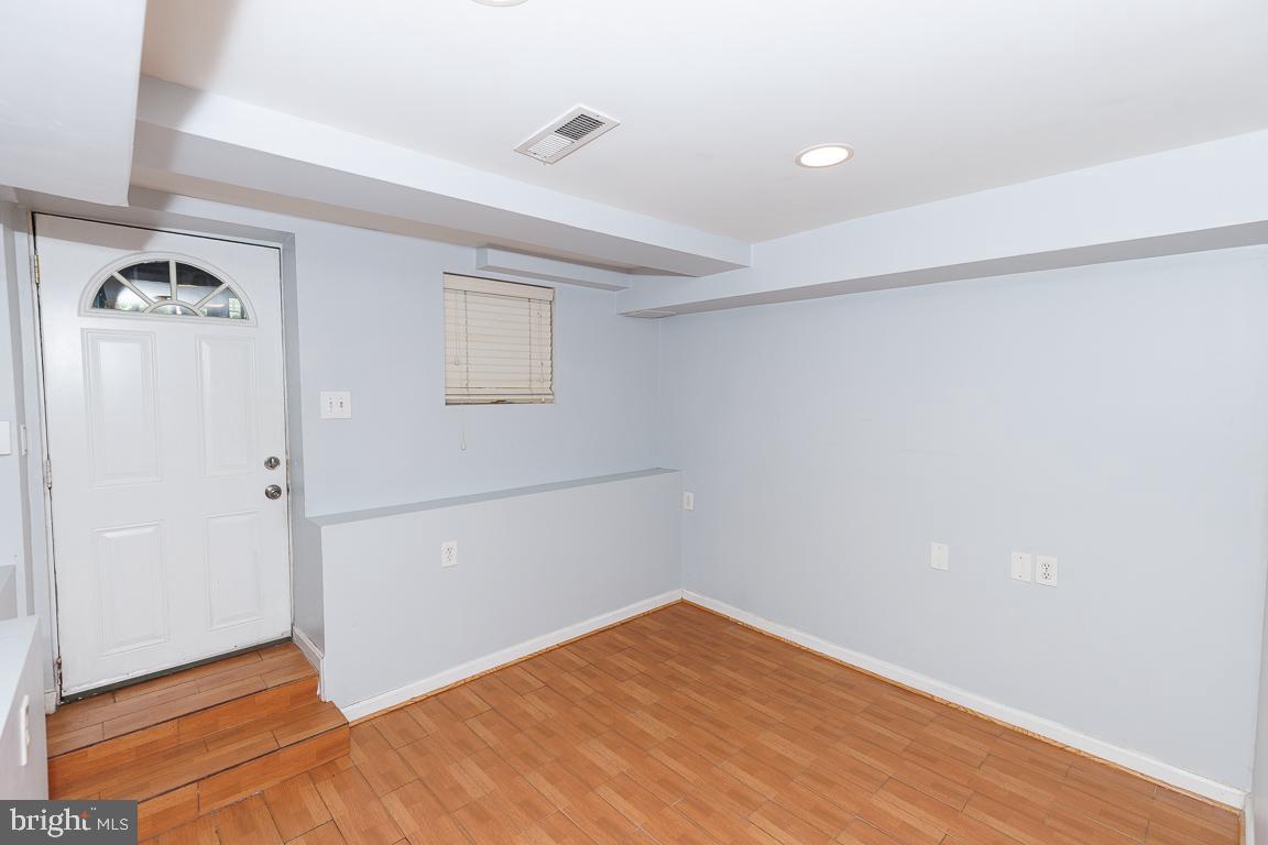1437 East Capitol Street Southeast, Unit B Washington, DC 20003 - Photo 13 of 20 an empty room with wooden floor and closet