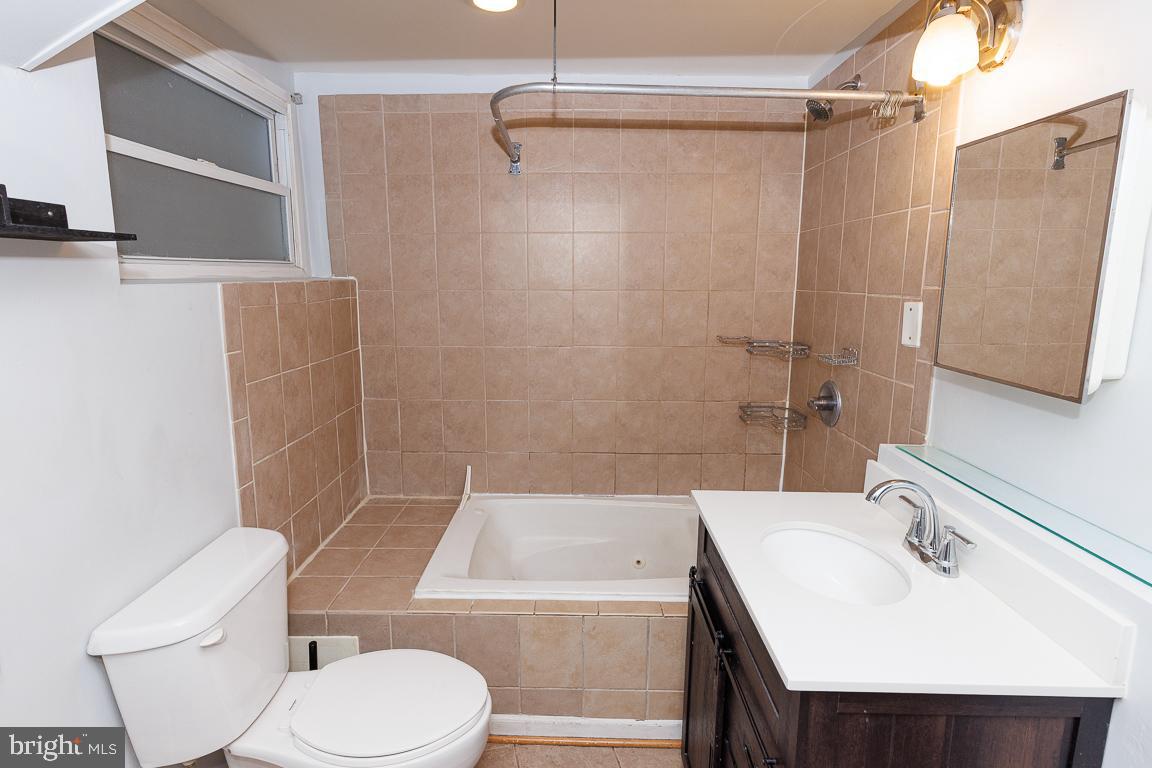 1437 East Capitol Street Southeast, Unit B Washington, DC 20003 - Photo 17 of 20 a bathroom with a sink toilet and shower