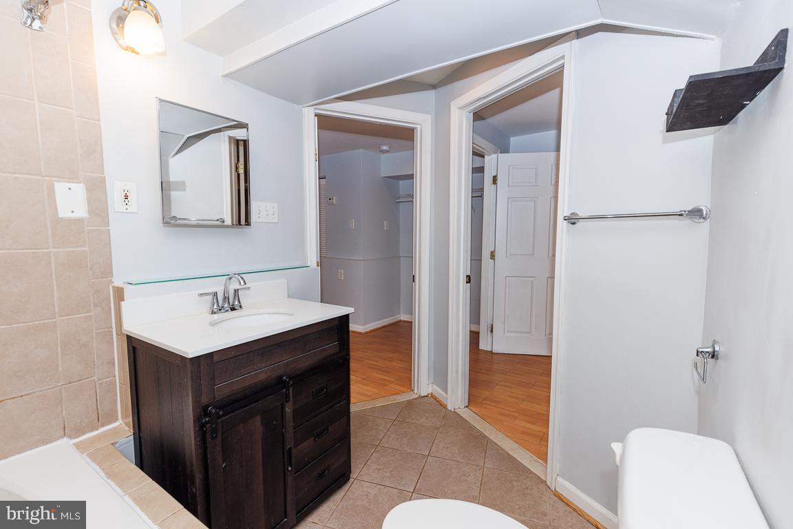 1437 East Capitol Street Southeast, Unit B Washington, DC 20003 - Photo 18 of 20 a bathroom with a sink a toilet and shower