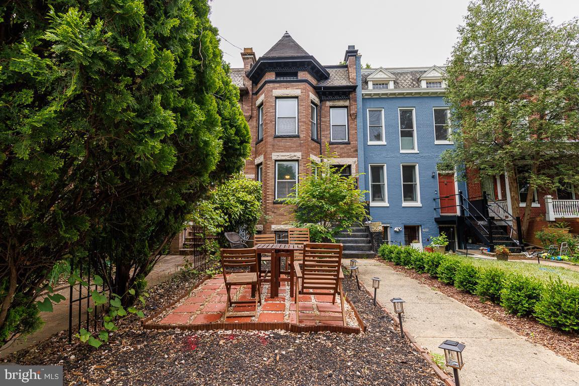 1437 East Capitol Street Southeast, Unit B Washington, DC 20003 - Photo 2 of 20 a front view of a house with a yard