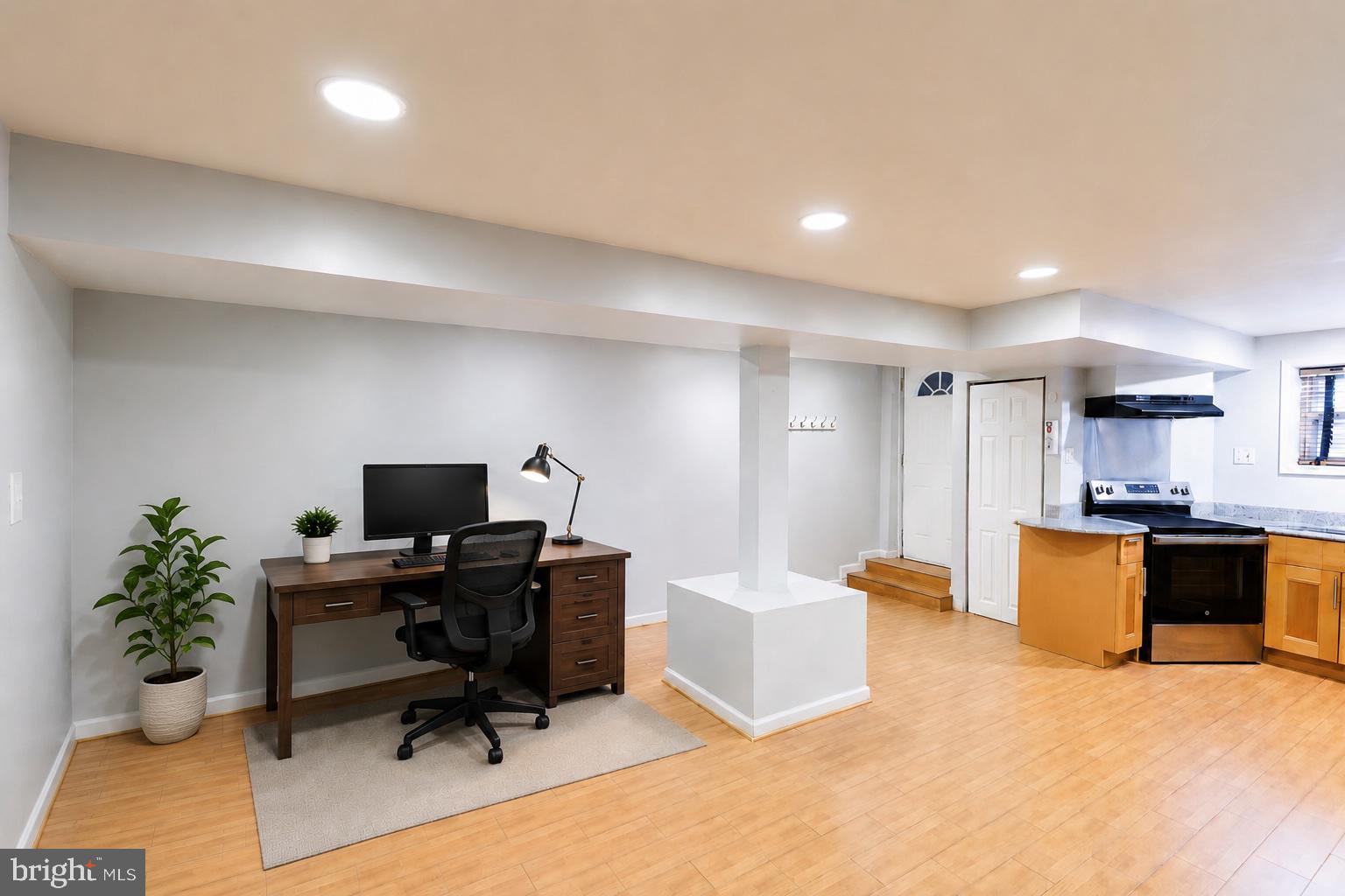 1437 East Capitol Street Southeast, Unit B Washington, DC 20003 - Photo 4 of 20 a view of a workspace with furniture and a workspace