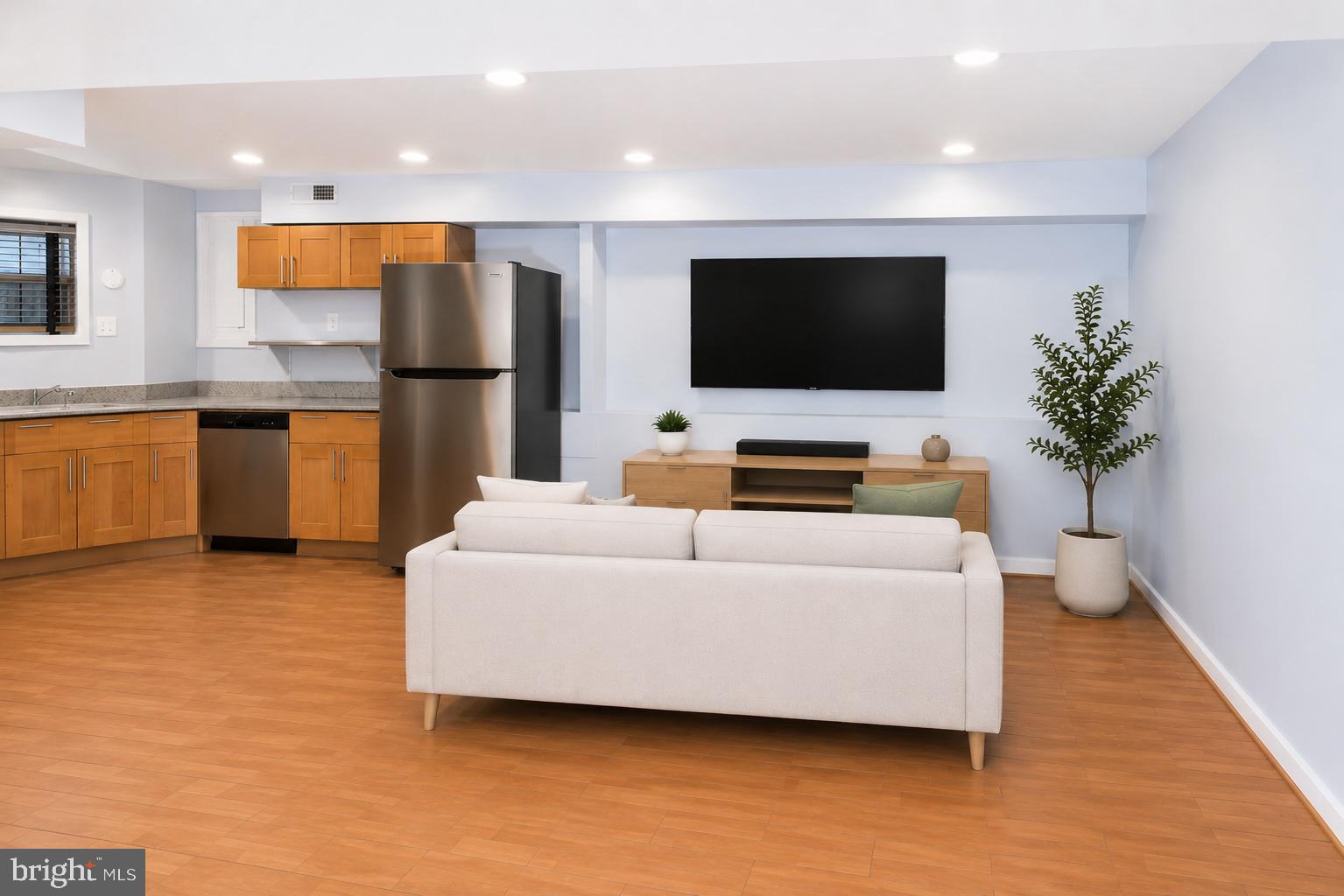 1437 East Capitol Street Southeast, Unit B Washington, DC 20003 - Photo 6 of 20 a living room with furniture and a flat screen tv