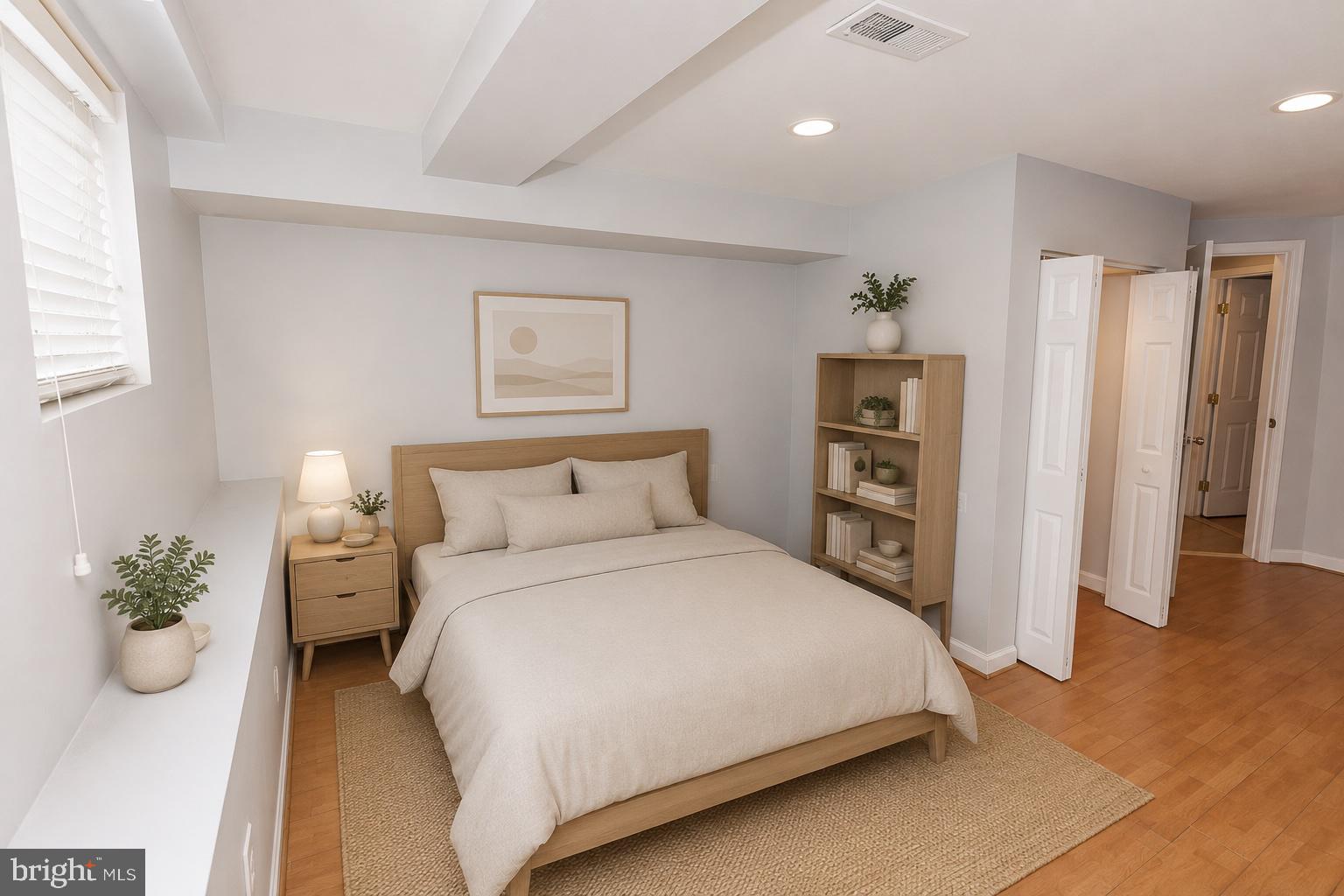 1437 East Capitol Street Southeast, Unit B Washington, DC 20003 - Photo 10 of 20 a bedroom with a bed and a potted plant