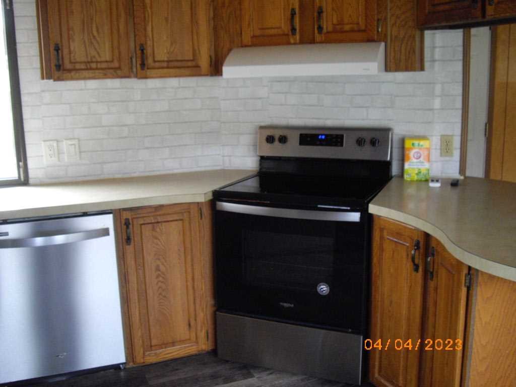198 Sinpatch Road Amenia, NY 12592 - Photo 6 of 35 a kitchen with stainless steel appliances wooden cabinets and a stove top oven