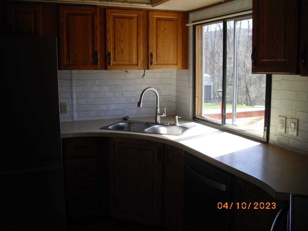 198 Sinpatch Road Amenia, NY 12592 - Photo 7 of 35 a kitchen with a sink and a window