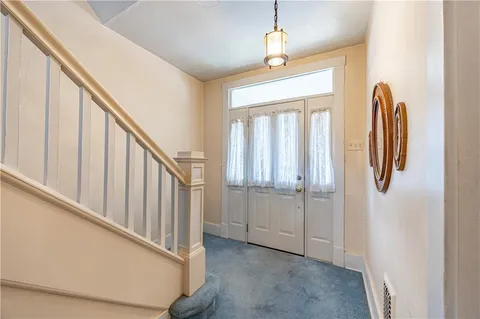 a view of a hallway with windows