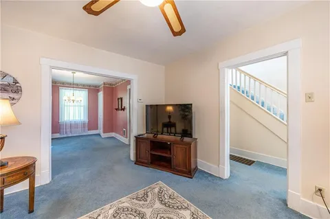 a view of a livingroom with furniture and windows