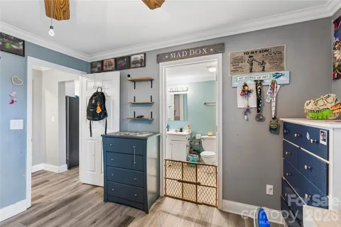a view of hallway with wooden floor