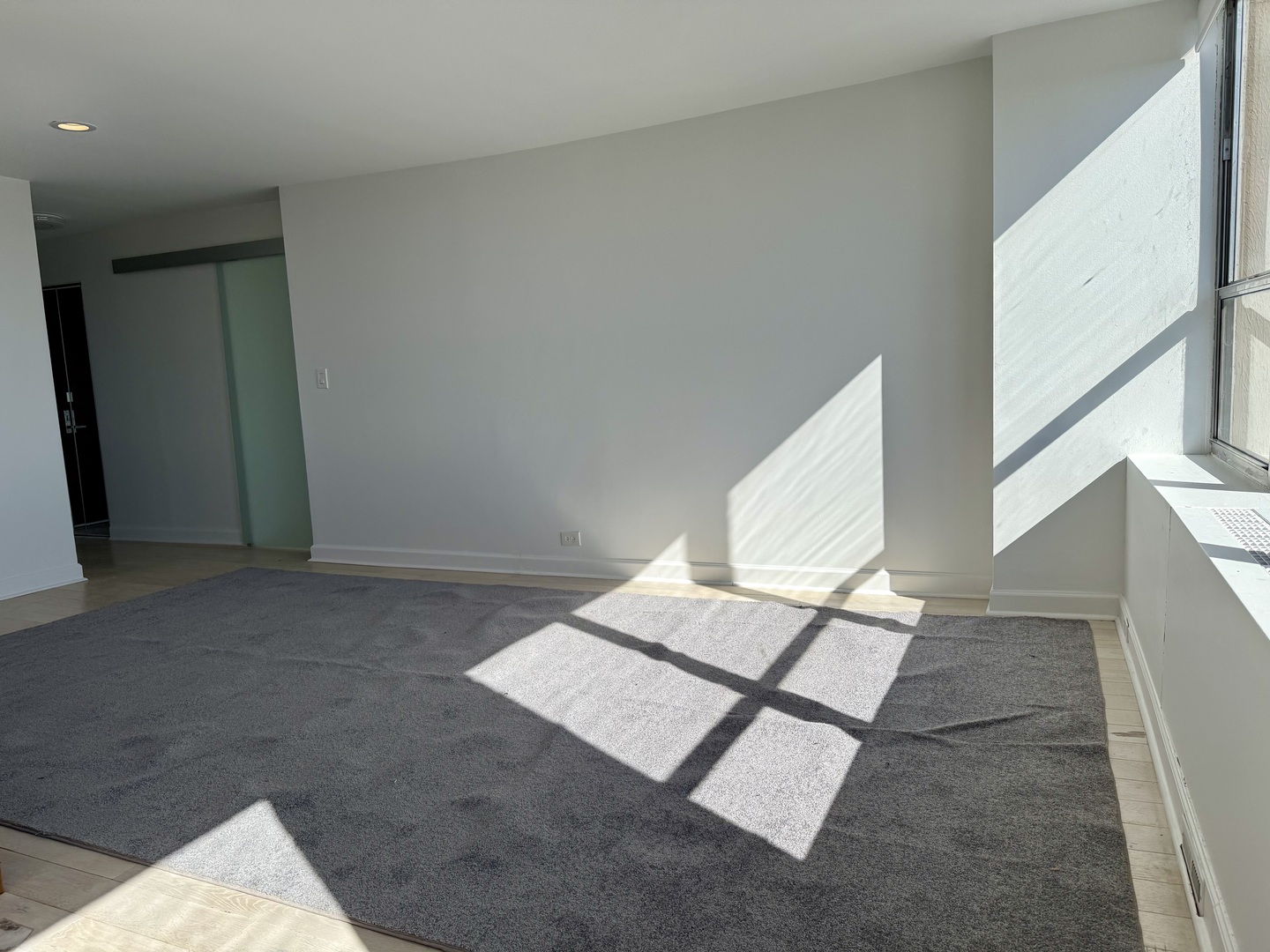 655 West Irving Park Road, Unit 5513 Chicago, IL 60613 - Photo 5 of 17 a view of an empty room with windows