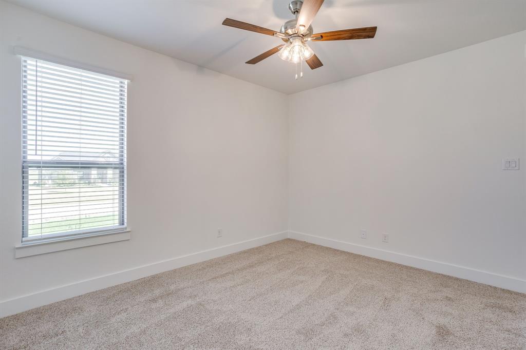 10611 Rye Bread Lane Venus, TX 76084 - Photo 26 of 36 Carpeted flooring, white walls, window with blinds, and a ceiling fan with light fixture