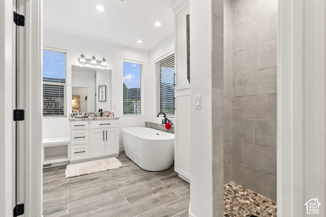 244 East Sevier River Road Central Valley, UT 84754 - Photo 47 of 66 White vanity with granite-style countertop, undermount sink, and three-light fixture