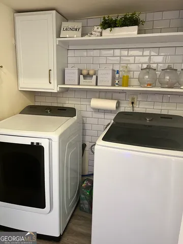 a utility room with dryer and washer
