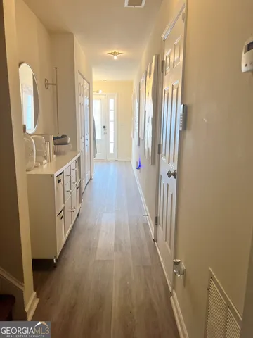 a view of a bathroom from the hallway