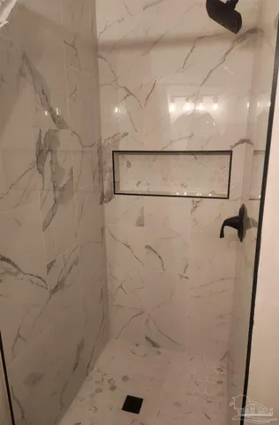 a room with a window and furniture