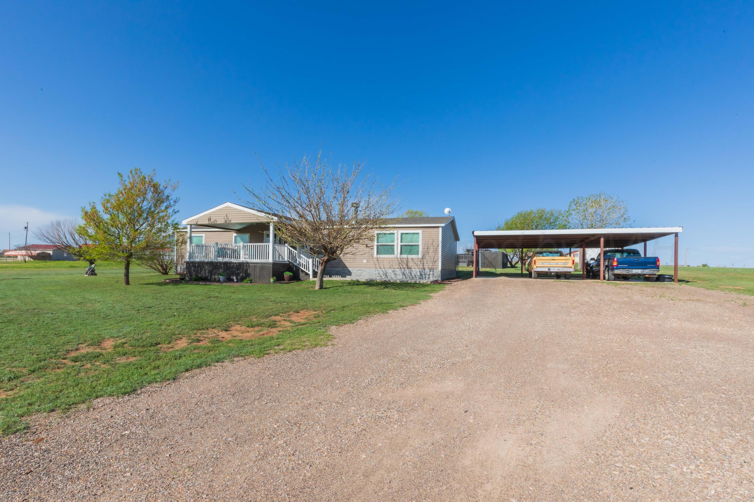 a view of house with outdoor space and street