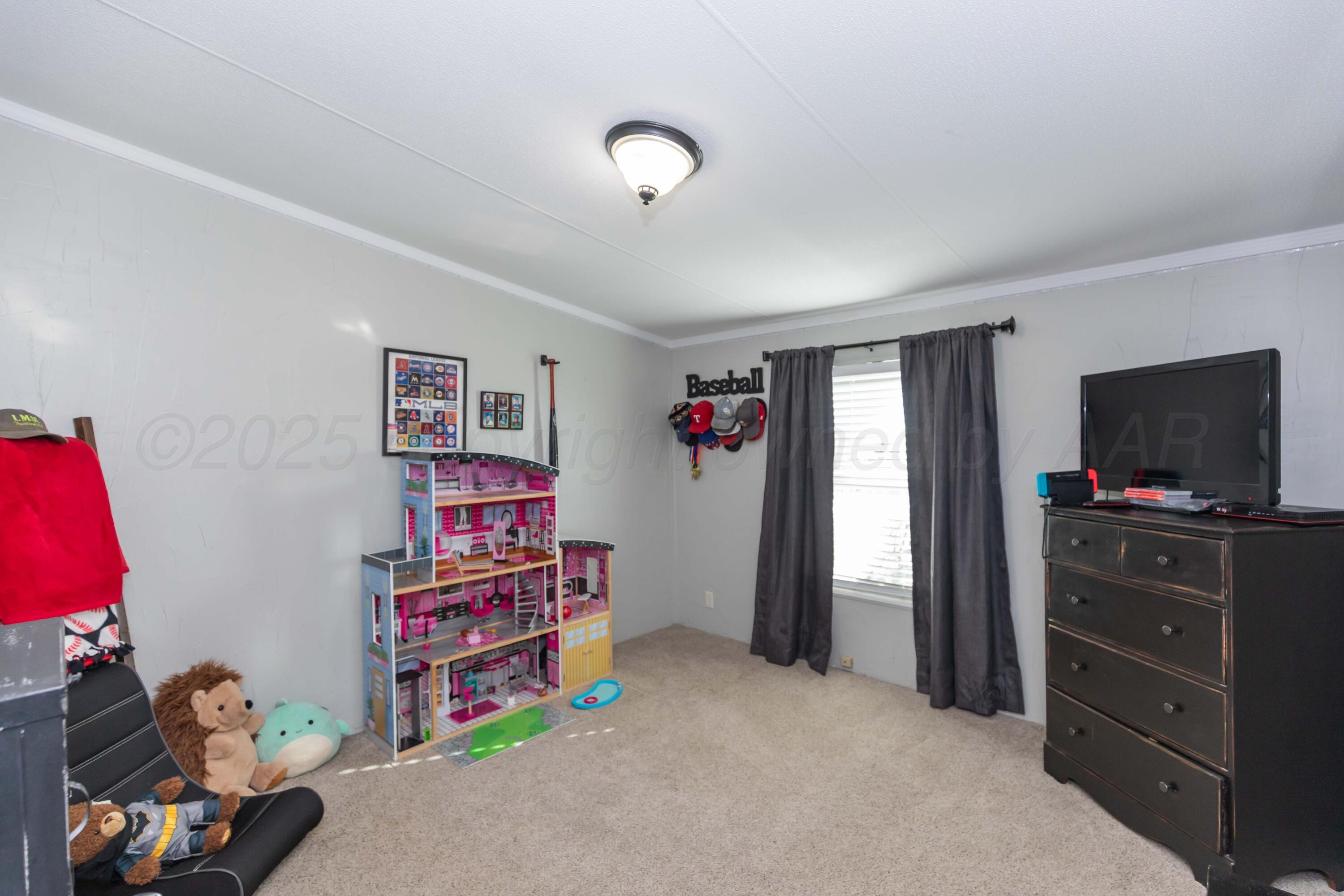7501 Lobo Trail Amarillo, TX 79124 - Photo 30 of 49 a view of a bedroom with baby crib and toys