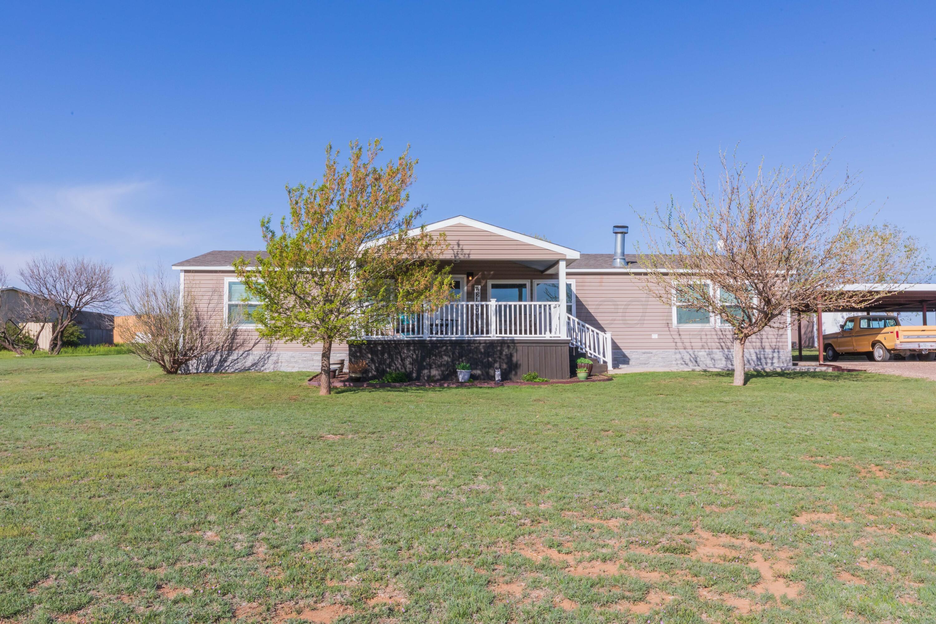 7501 Lobo Trail Amarillo, TX 79124 - Photo 3 of 49 a view of a house with a yard