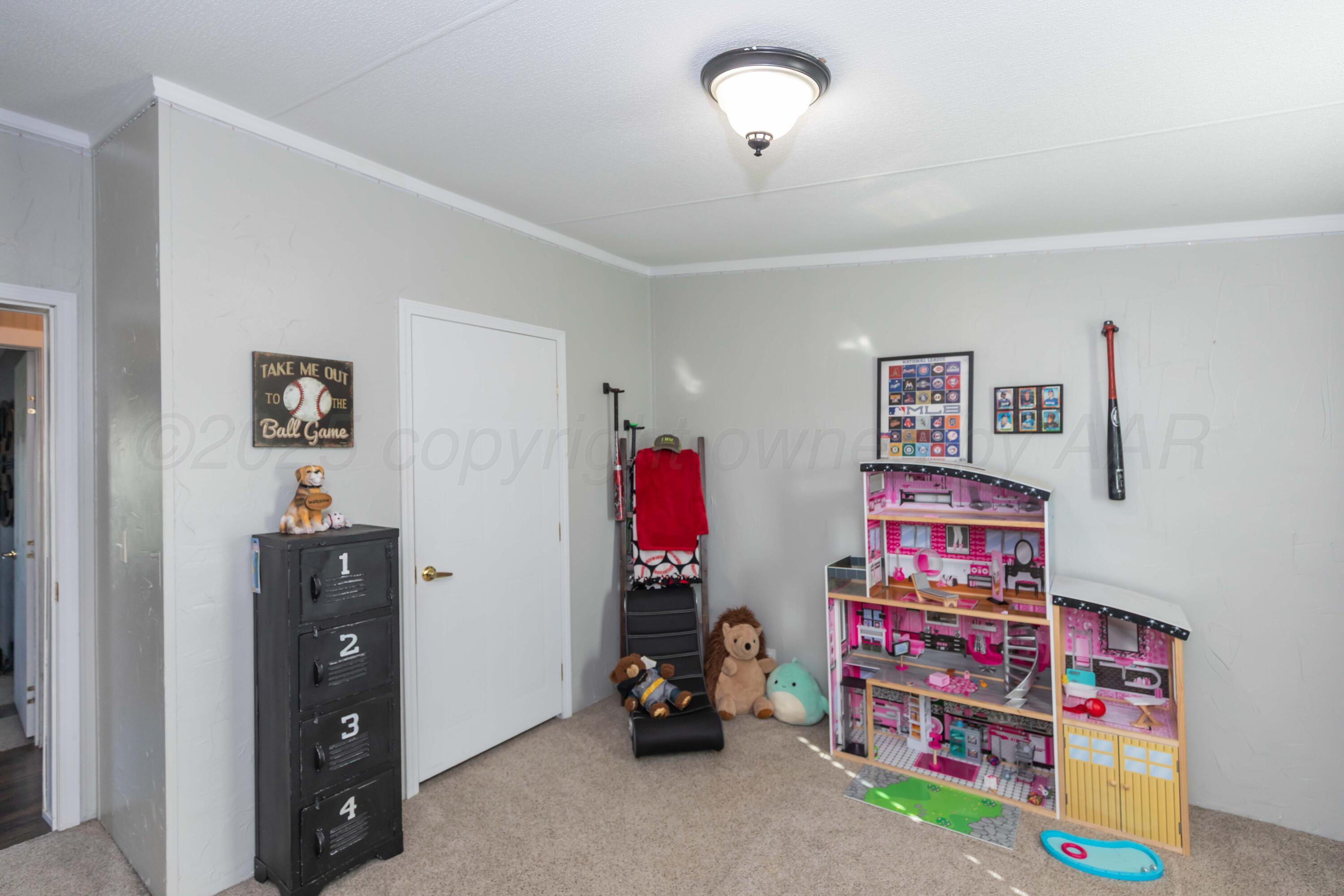 7501 Lobo Trail Amarillo, TX 79124 - Photo 32 of 49 a children room with toys and dresser