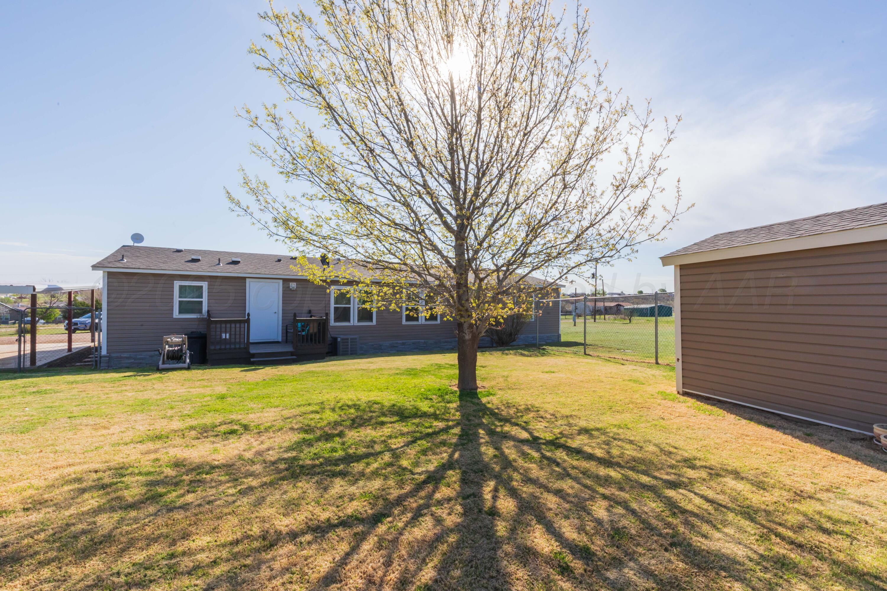 7501 Lobo Trail Amarillo, TX 79124 - Photo 46 of 49 a view of a house with a yard covered with snow in front of house