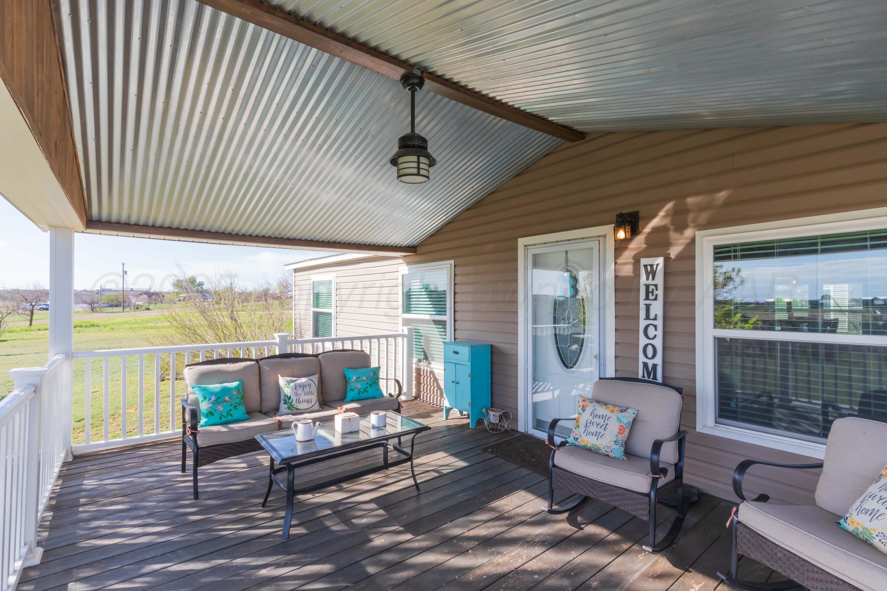 7501 Lobo Trail Amarillo, TX 79124 - Photo 6 of 49 a outdoor living space with furniture and a ceiling fan