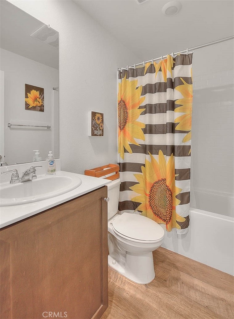 885 Canopy Lane San Jacinto, CA 92583 - Photo 12 of 75 a bathroom with a sink toilet and shower