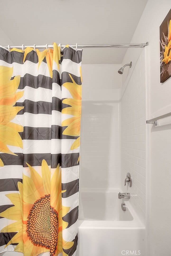 885 Canopy Lane San Jacinto, CA 92583 - Photo 13 of 75 a bathroom with a bathtub and a shower