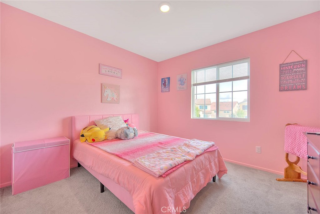 885 Canopy Lane San Jacinto, CA 92583 - Photo 30 of 75 a bedroom with a bed and a window