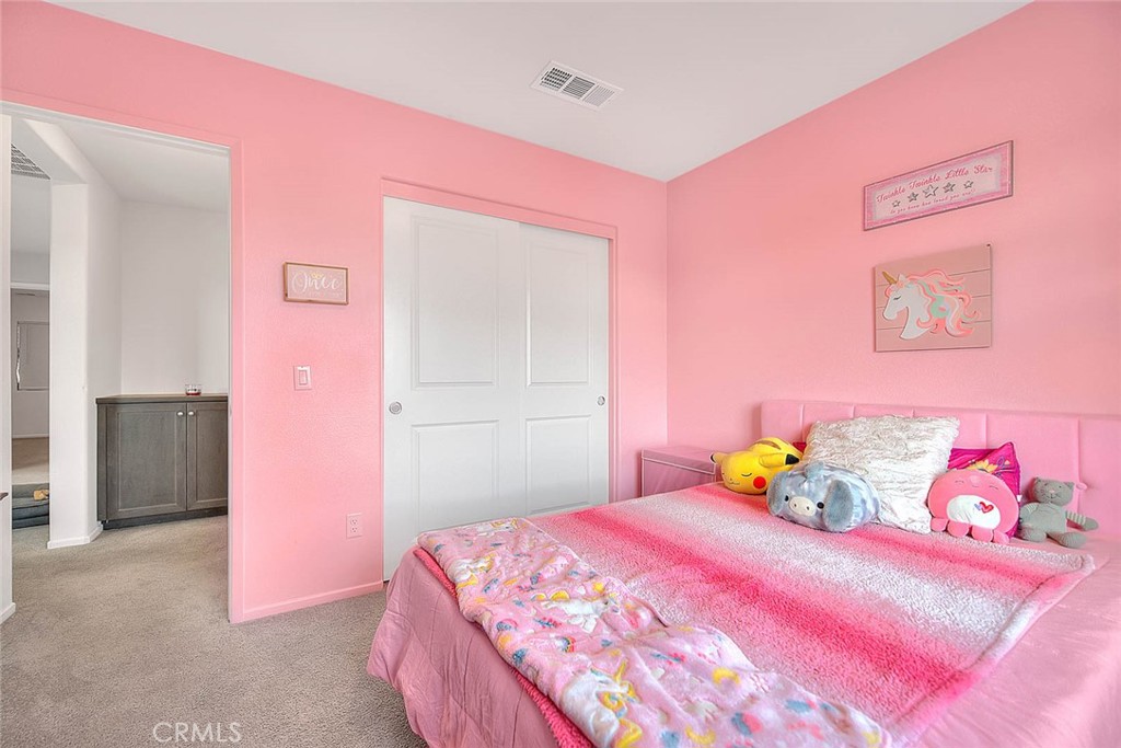 885 Canopy Lane San Jacinto, CA 92583 - Photo 31 of 75 a bedroom with a bed and a couch