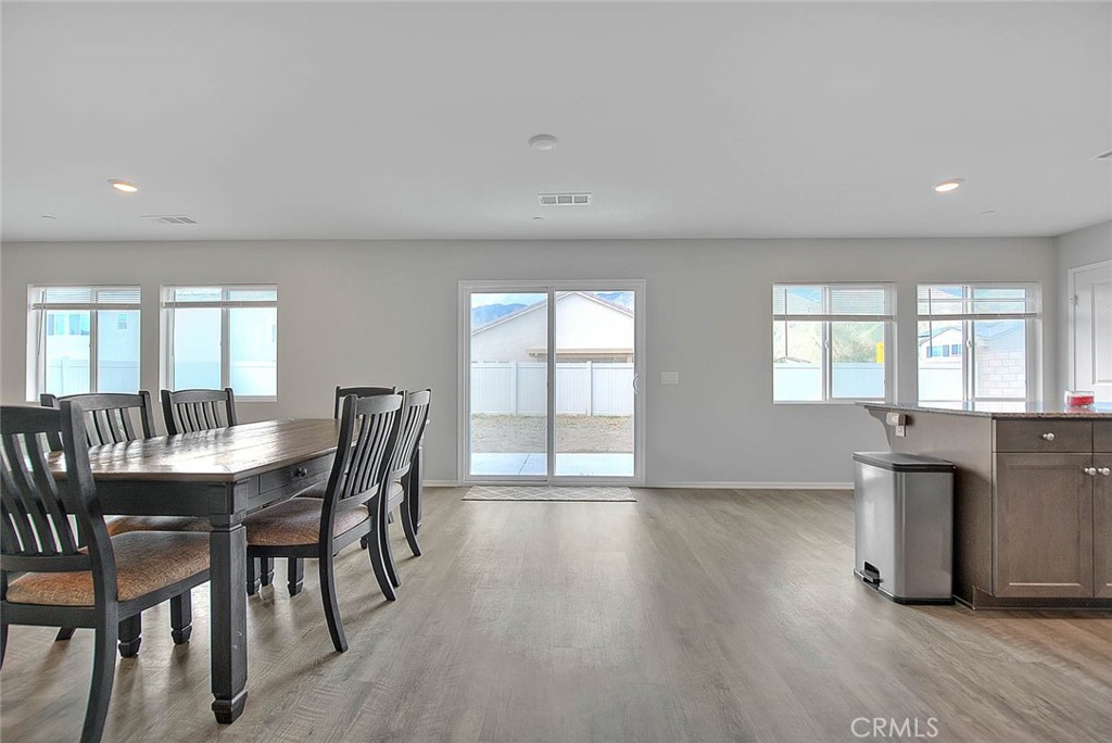 885 Canopy Lane San Jacinto, CA 92583 - Photo 35 of 75 a view of a dining room with furniture and wooden floor