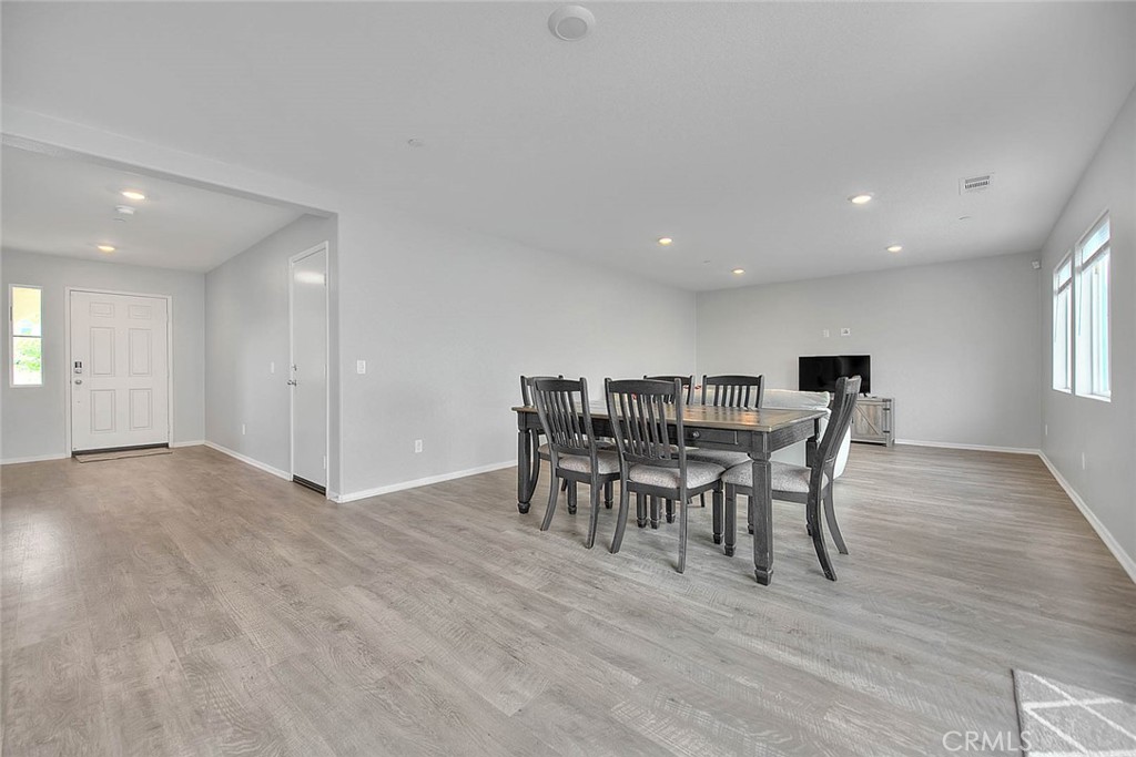 885 Canopy Lane San Jacinto, CA 92583 - Photo 36 of 75 a view of a dining room with furniture and wooden floor