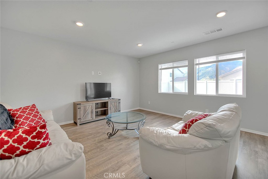 885 Canopy Lane San Jacinto, CA 92583 - Photo 41 of 75 a living room with furniture and a flat screen tv